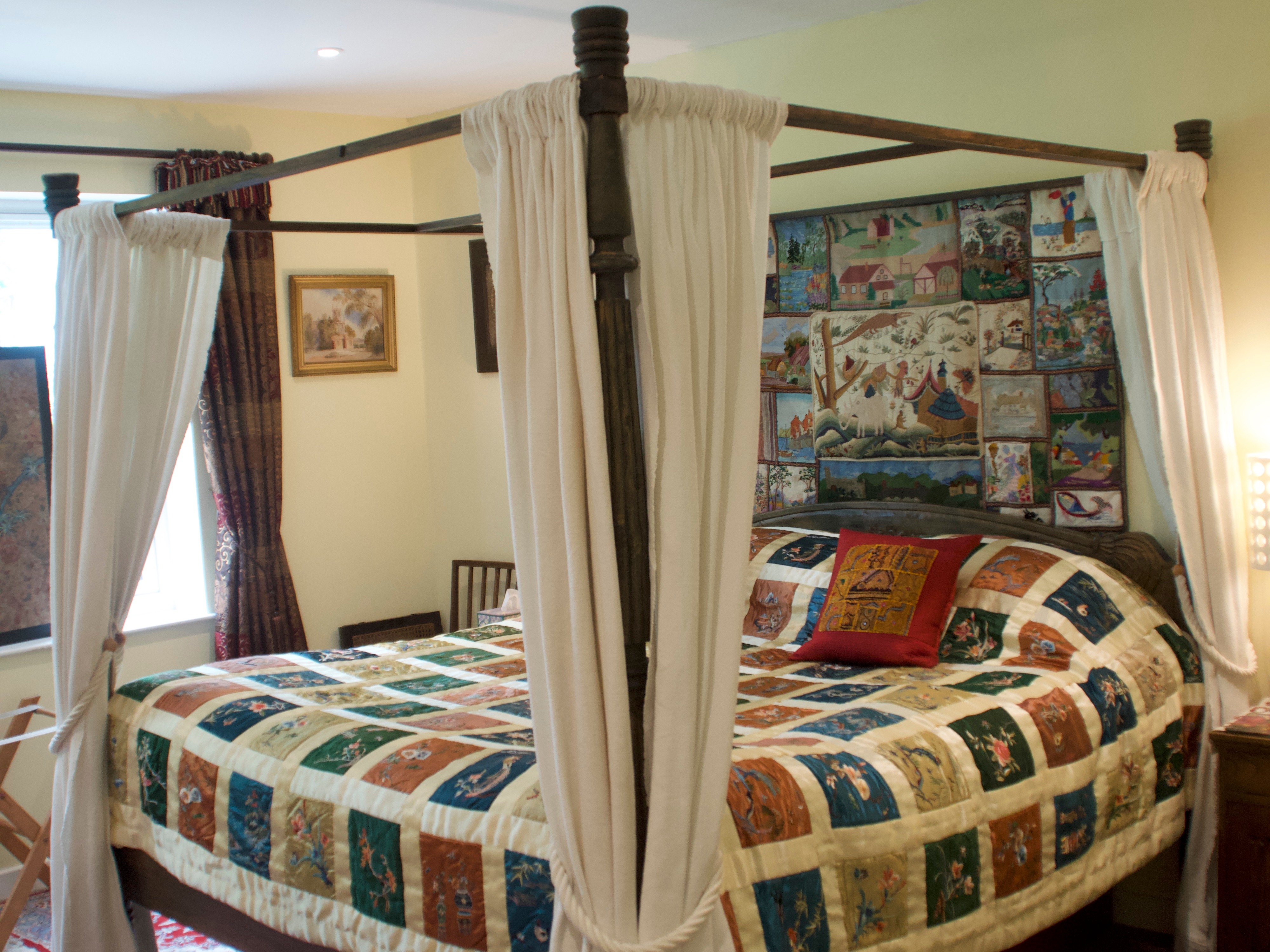 Double bed with pictures hanging up