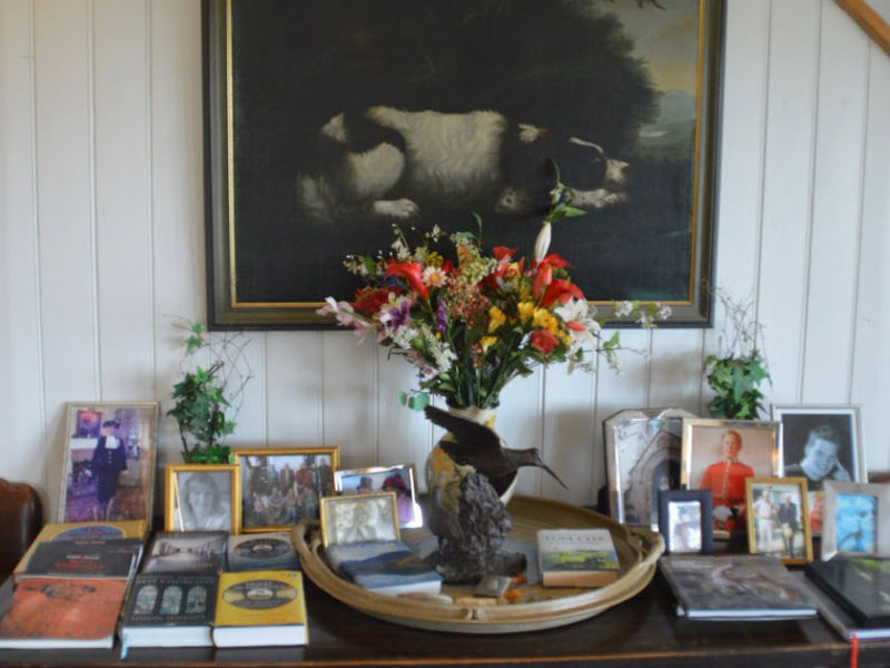 Flower vase with a picture of a dog in the background