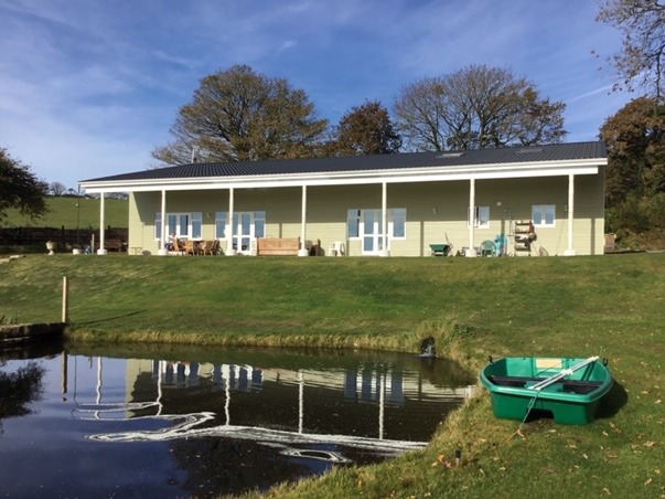 Green grass, with Lake by Air B&B