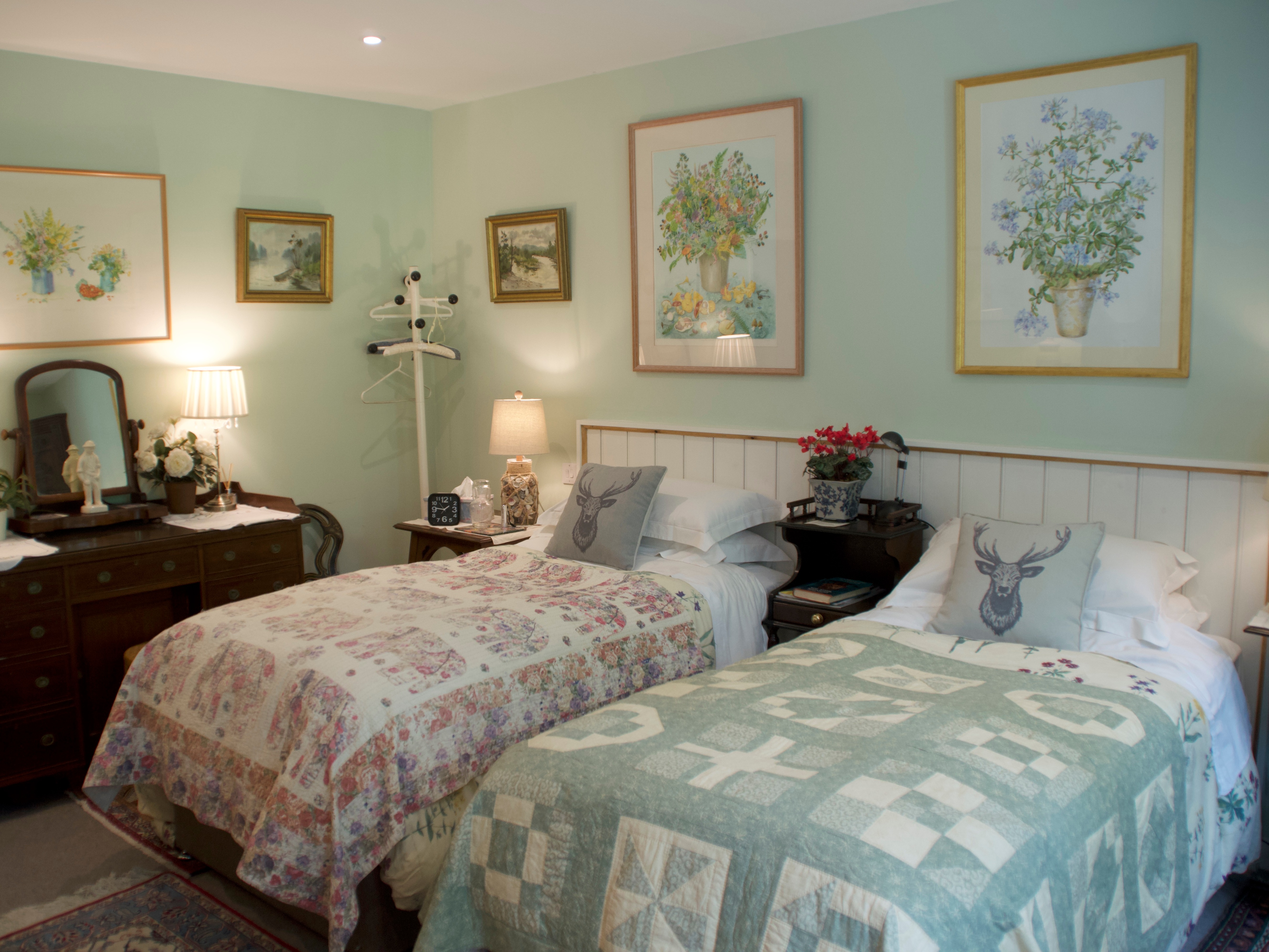 Two single beds with The Old Deer House pillows